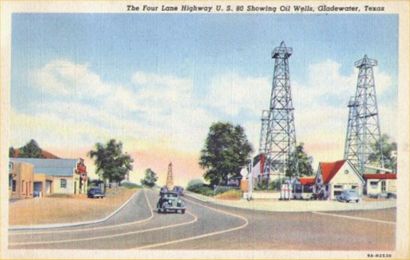 The four lane highway U.S. 80 showing oil wells, Gladewater, Texas