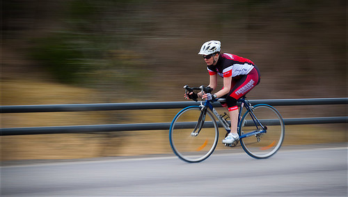 Bike rider racing to the finish line, in East Texas